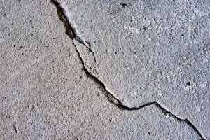 earthquake cracked gray concrete surface